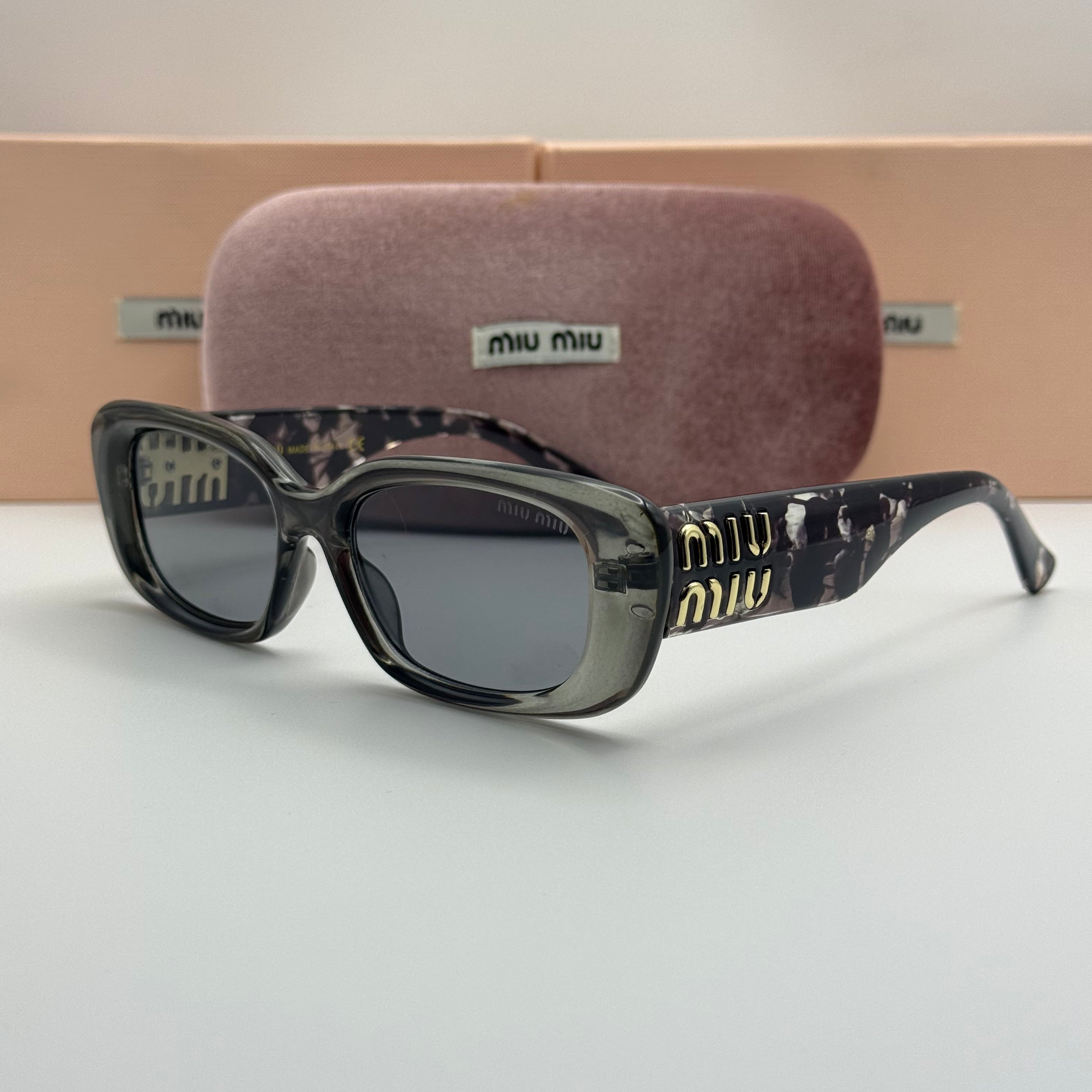 Miu Miu Rectangle Sunglasses – Transparent Grey & Dark Lenses