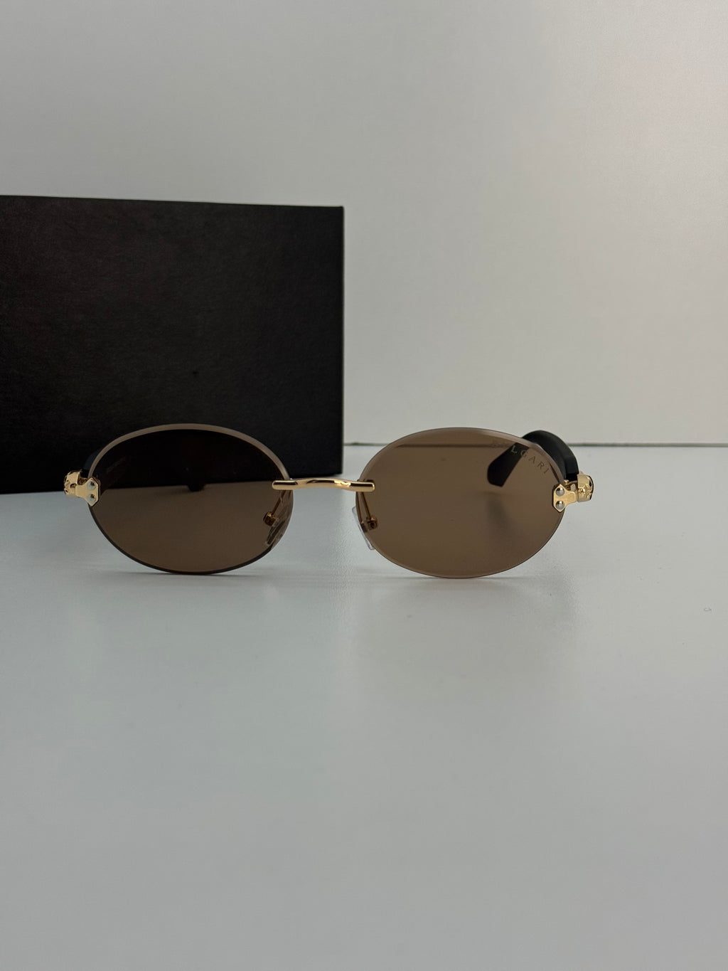 Bvlgari Serpenti Rimless Sunglasses – Gold & Black