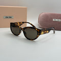 Miu Miu Cat-Eye Sunglasses – Tortoiseshell