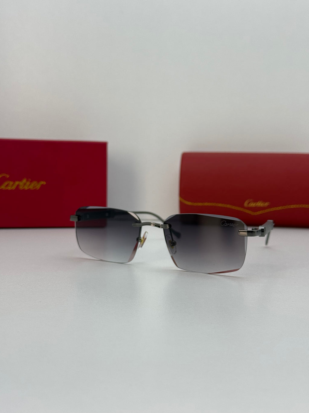 Cartier Rimless Rectangular Gradient Sunglasses – Silver / Gunmetal Grey
