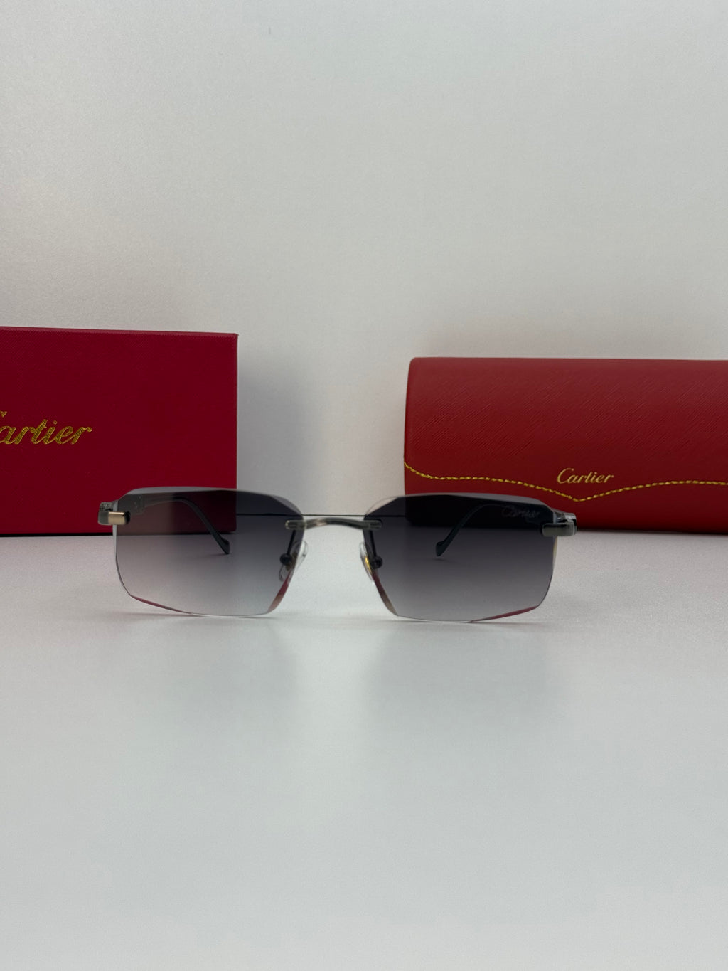 Cartier Rimless Rectangular Gradient Sunglasses – Silver / Gunmetal Grey