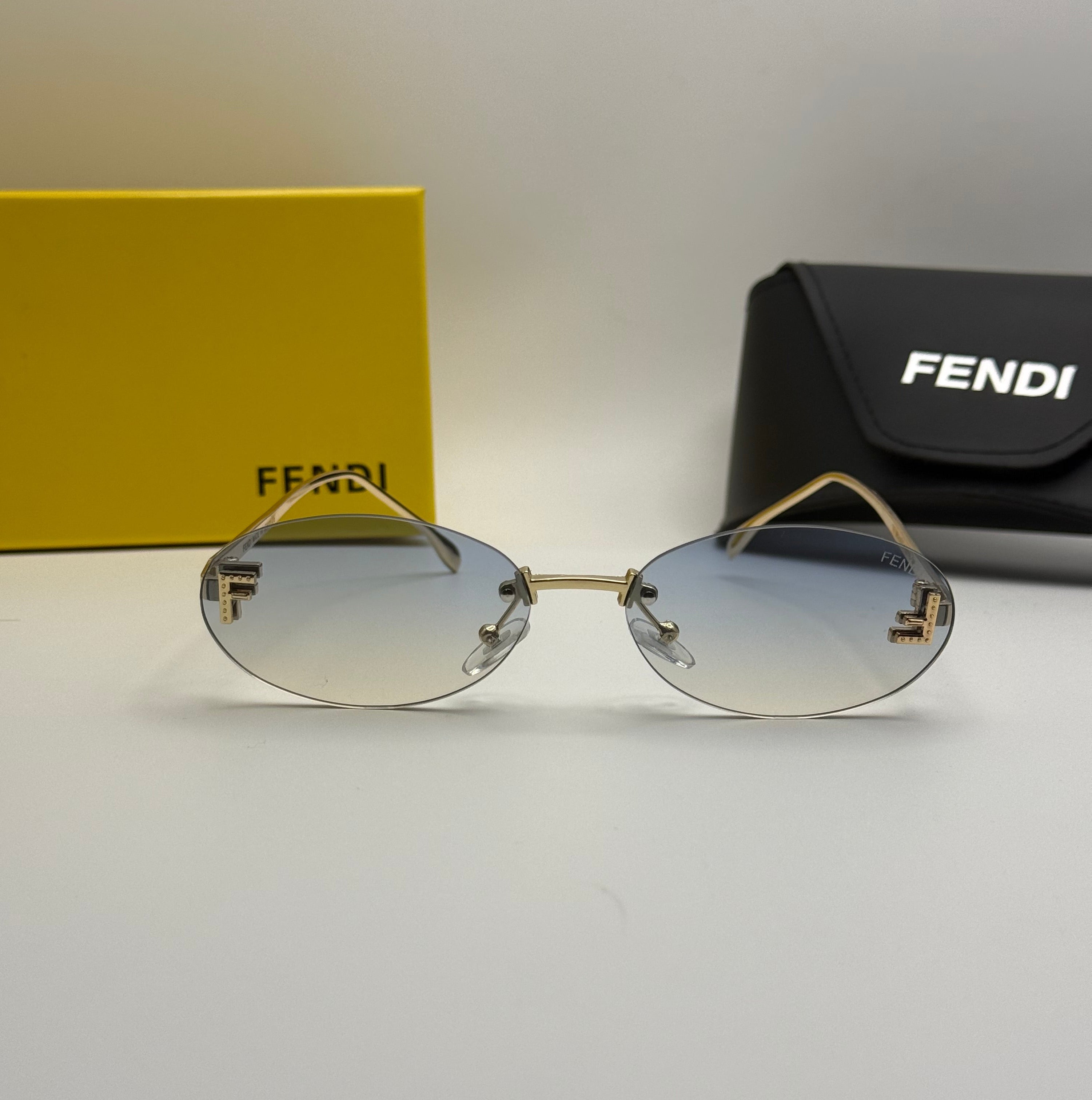 Fendi Rimless Oval Sunglasses – Gold / Blue Gradient