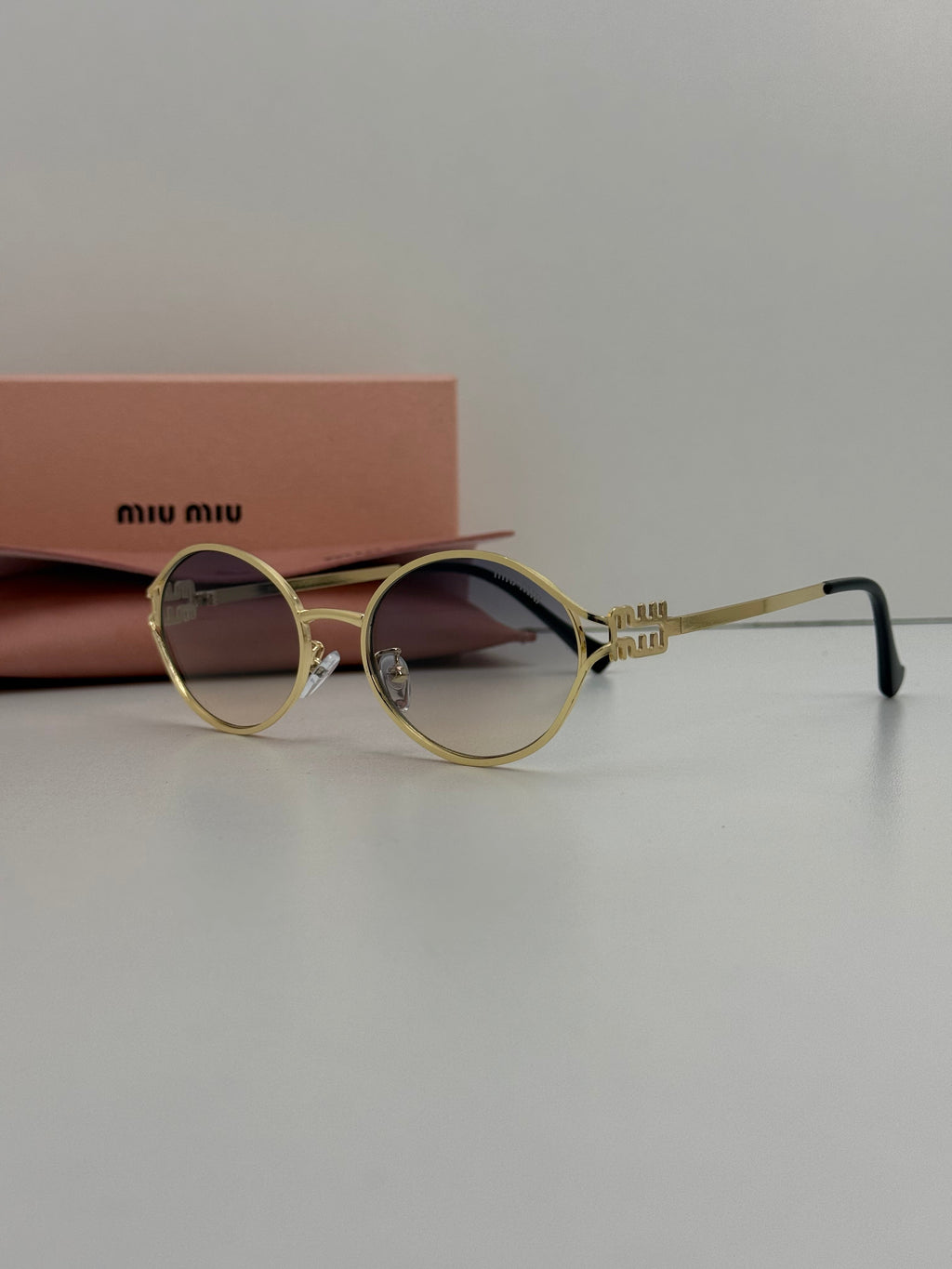 Miu Miu Oval Metal Sunglasses (Gold / Blue Grey Gradient )
