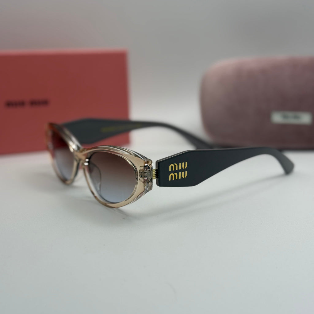 Miu Miu Oval Sunglasses – Transparent Champagne / Black Temples / Blue-Brown Gradient Lenses