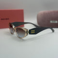 Miu Miu Oval Sunglasses – Transparent Champagne / Black Temples / Blue-Brown Gradient Lenses