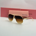 Miu Miu Aviator Sunglasses – Gold Frame / Amber Brown Gradient Lenses