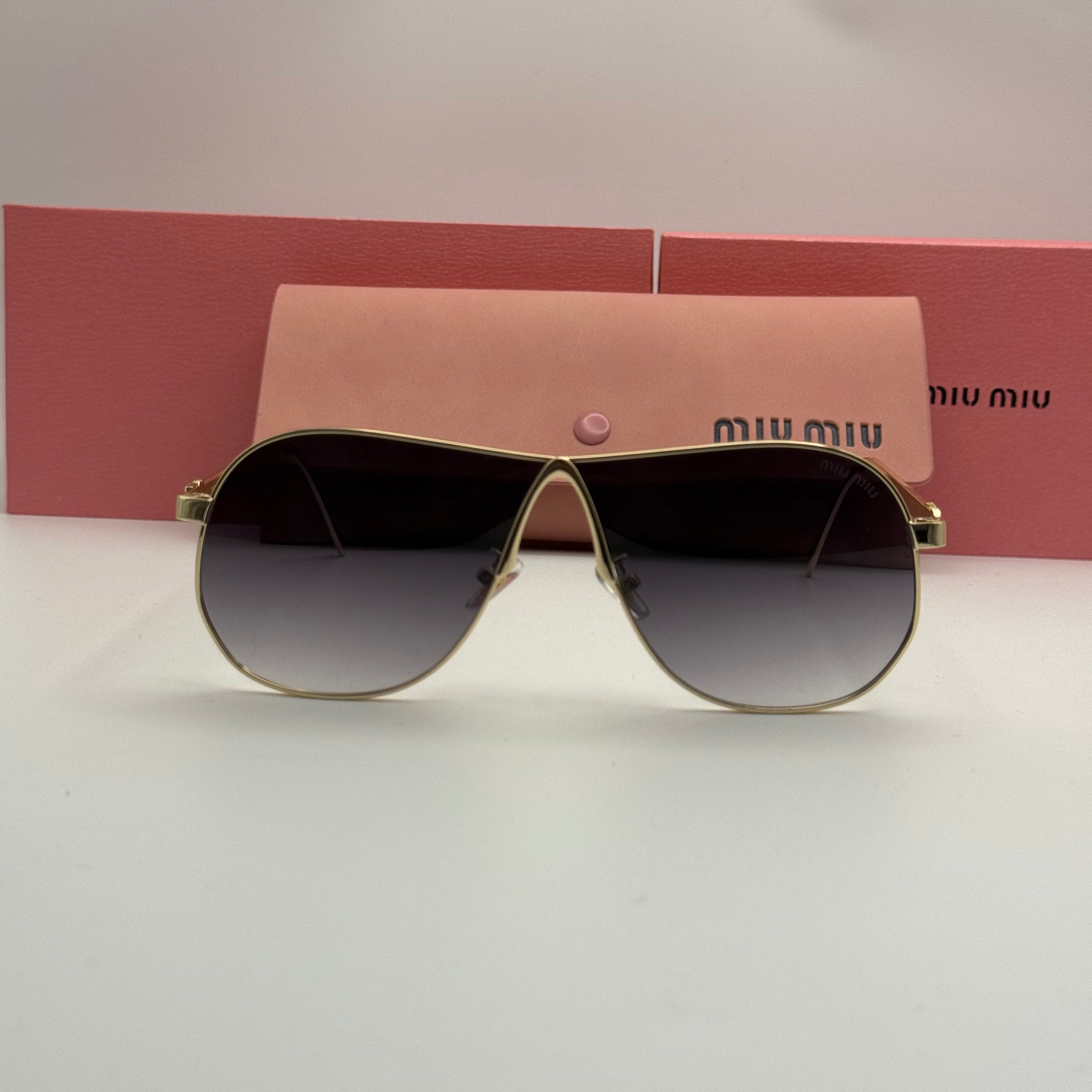 Miu Miu Aviator Sunglasses – Gold Frame / Grey Smoke Gradient Lenses