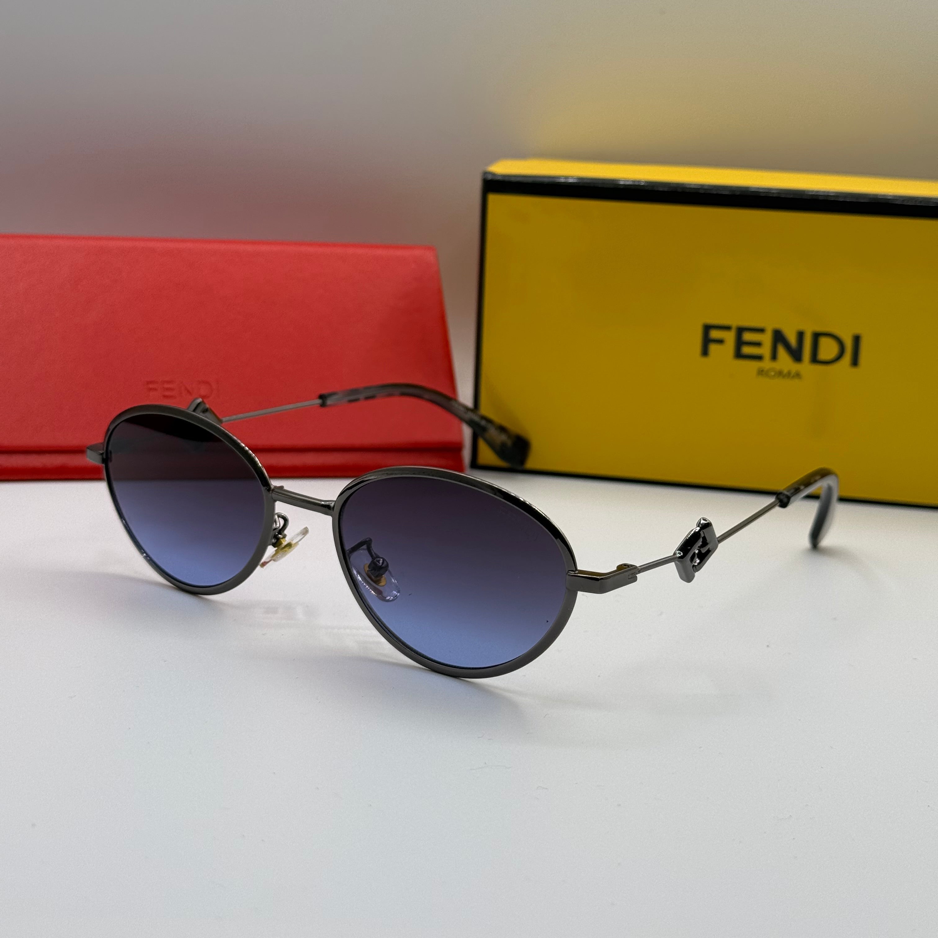 Fendi Round Sunglasses – Black Frame & Gradient Blue Lenses