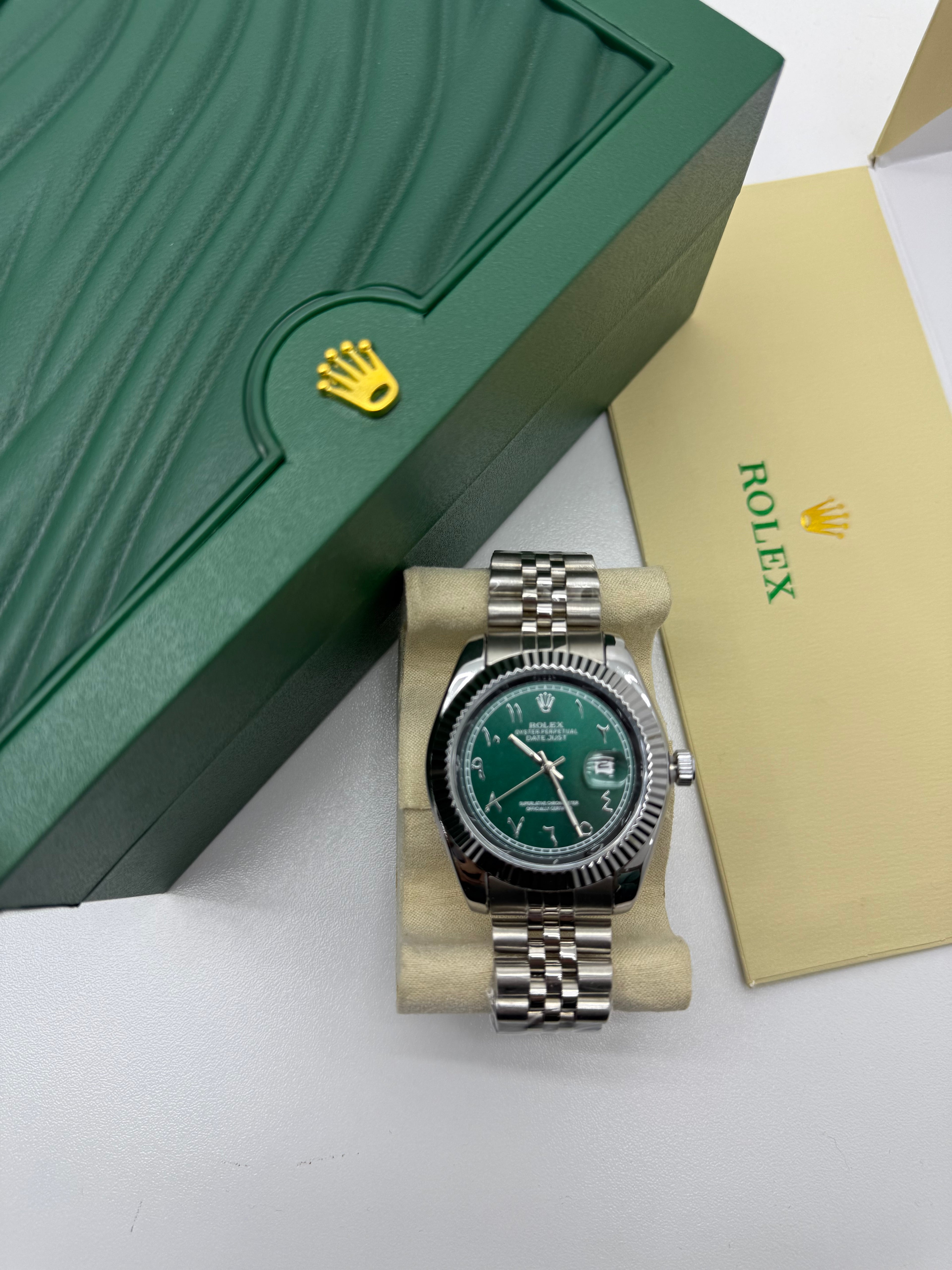 Rolex Datejust with a green dial