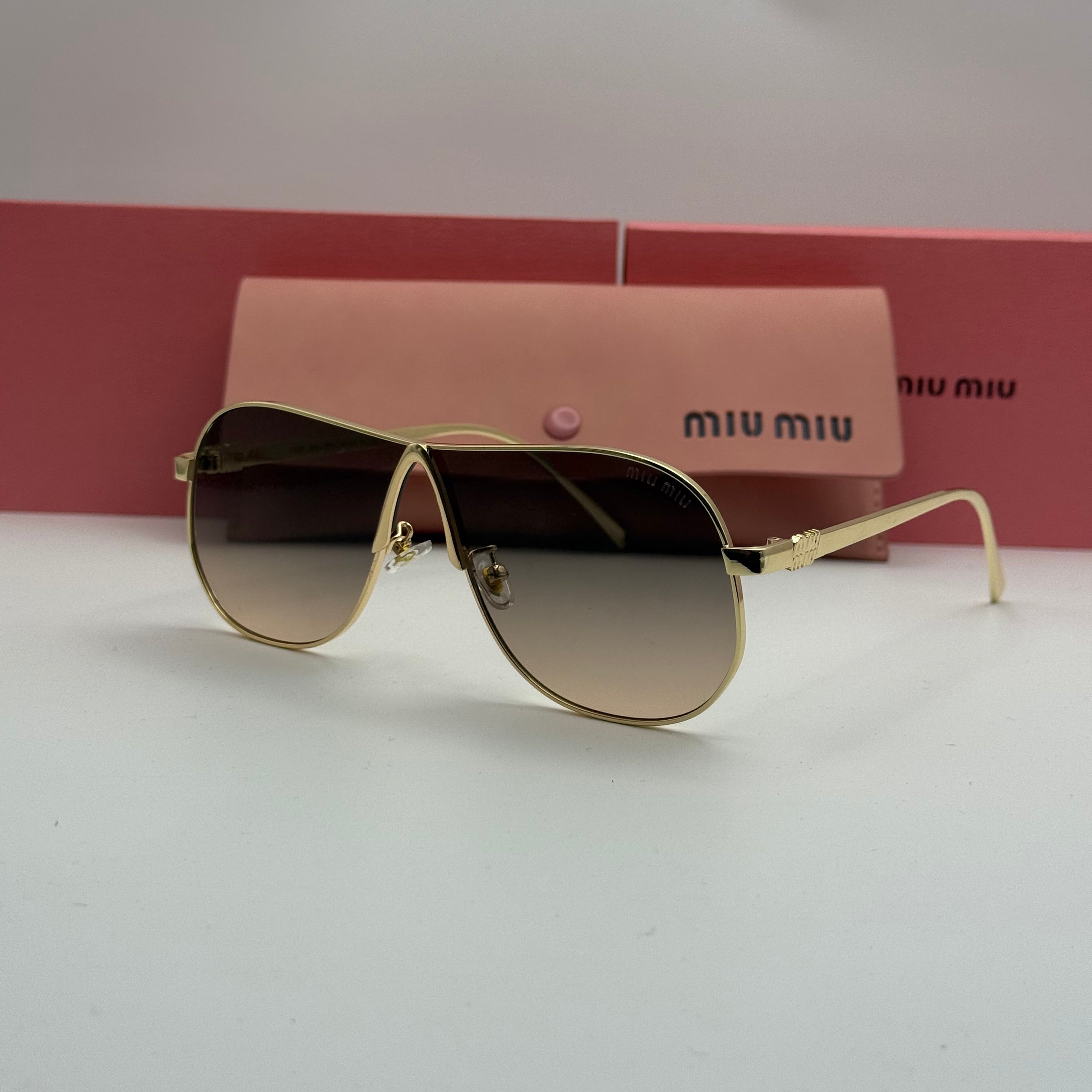 Miu Miu Aviator Sunglasses – Gold Frame / Brown Gradient Lenses