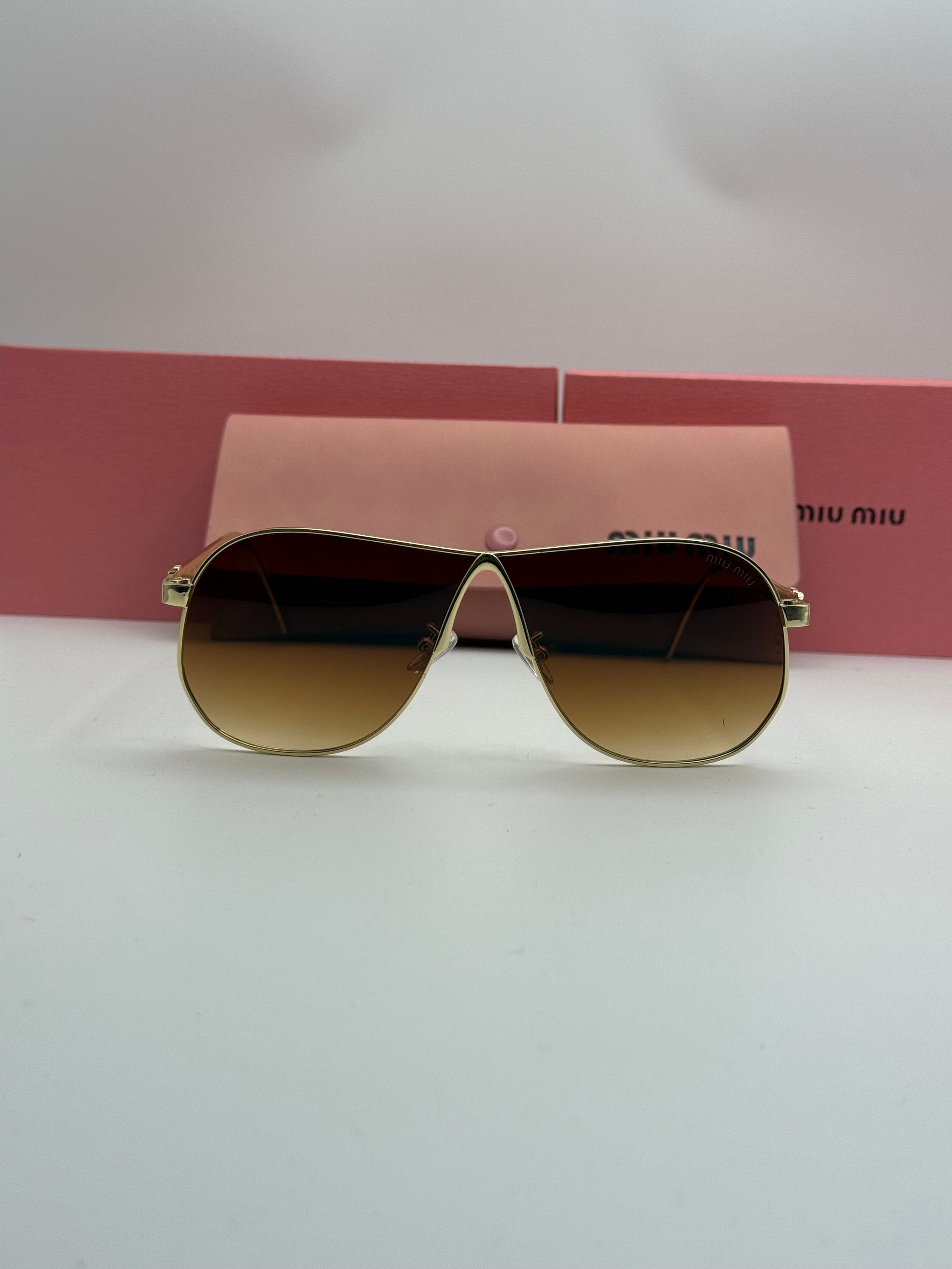 Miu Miu Aviator Sunglasses – Gold Frame / Amber Brown Gradient Lenses