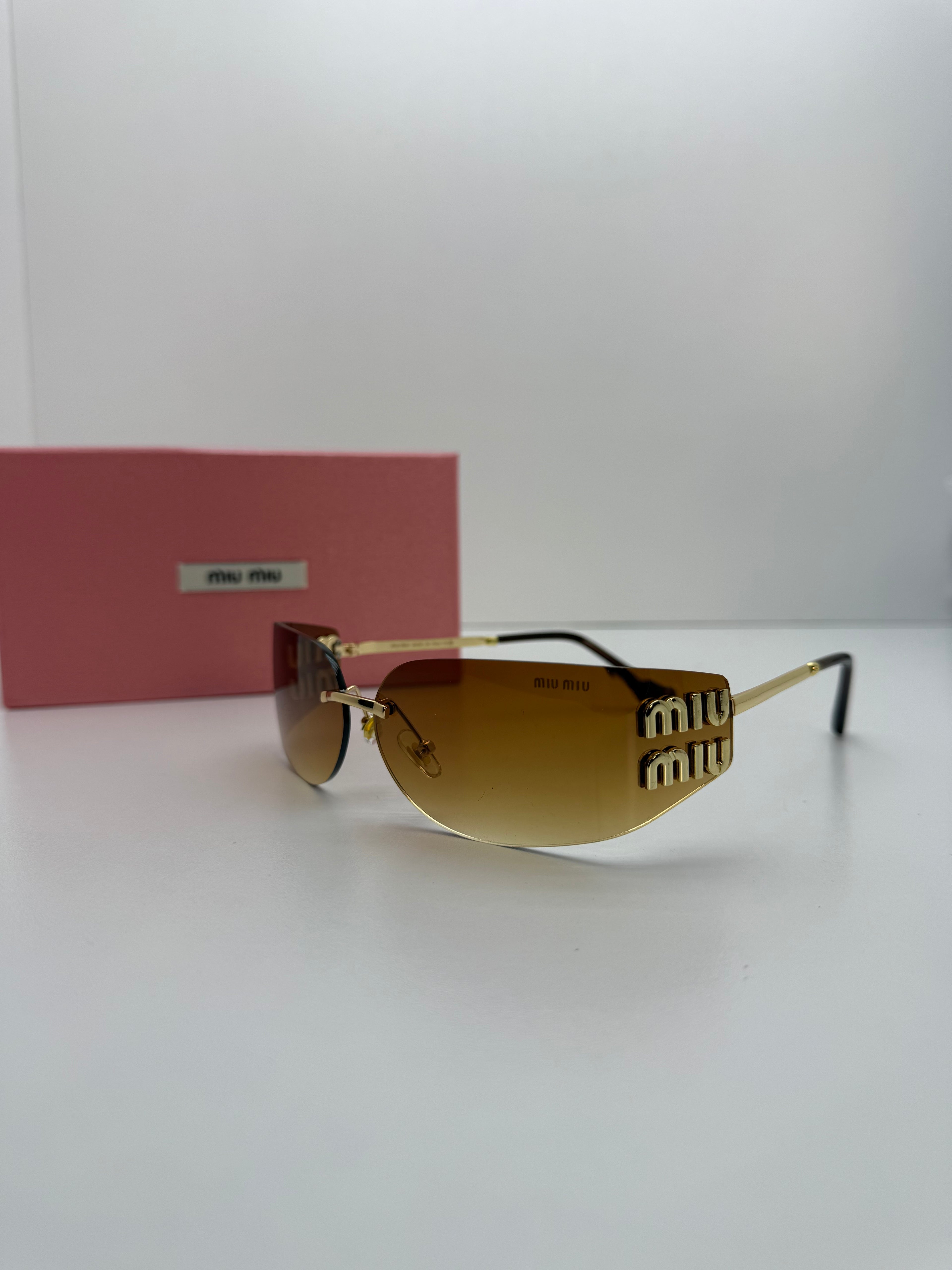 Miu Miu Brown Rimless Shield Sunglasses – Gold Logo Edition
