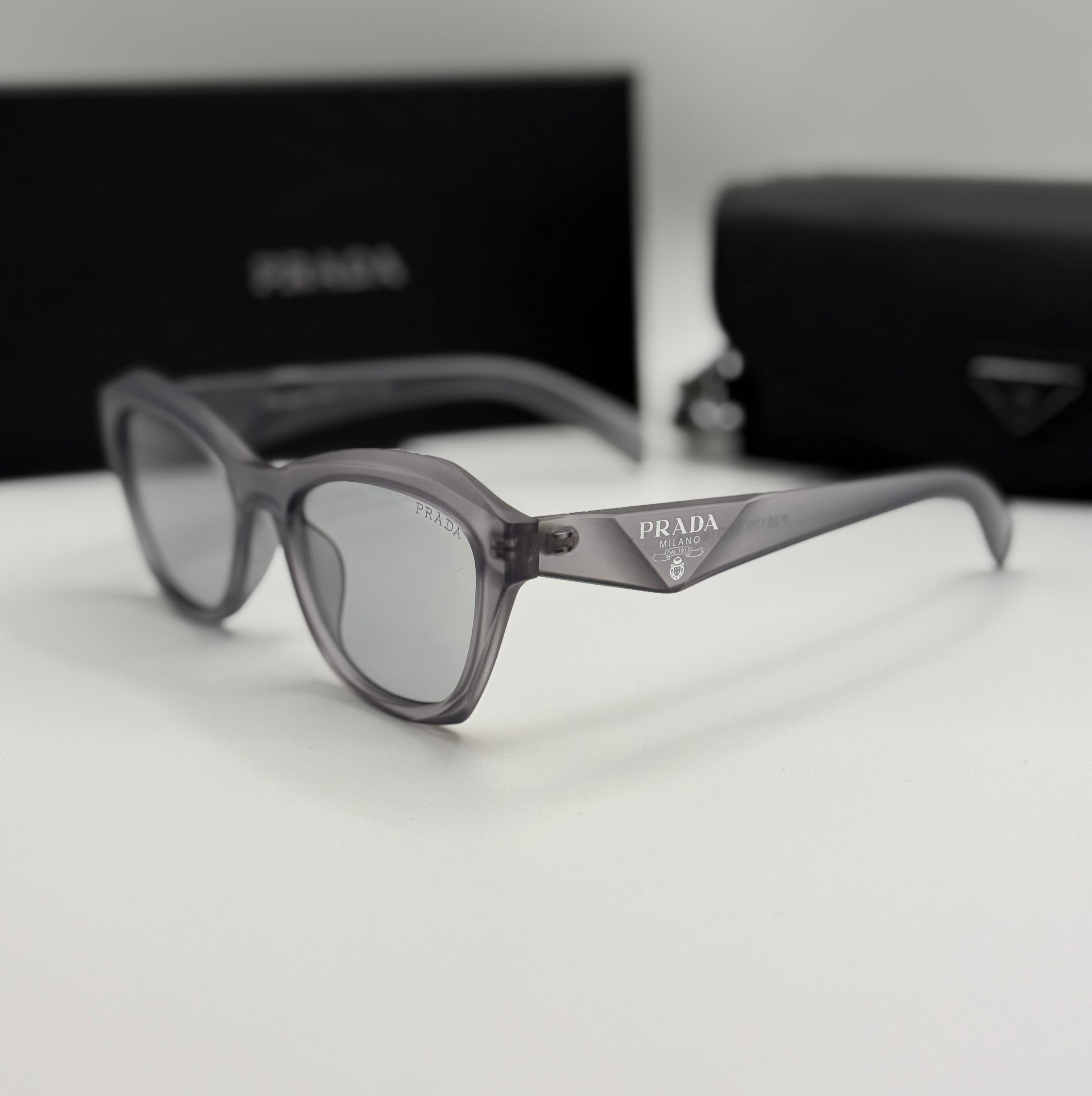 Prada Sunglasses – Grey Transparent Cat-Eye