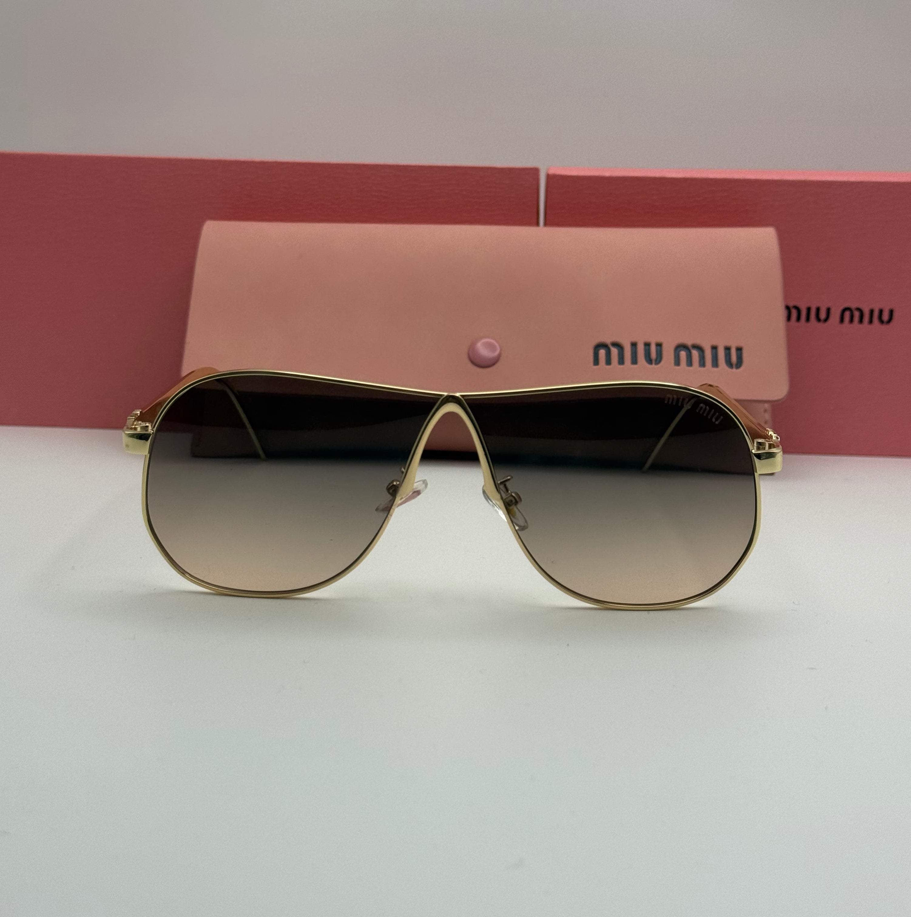 Miu Miu Aviator Sunglasses – Gold Frame / Brown Gradient Lenses