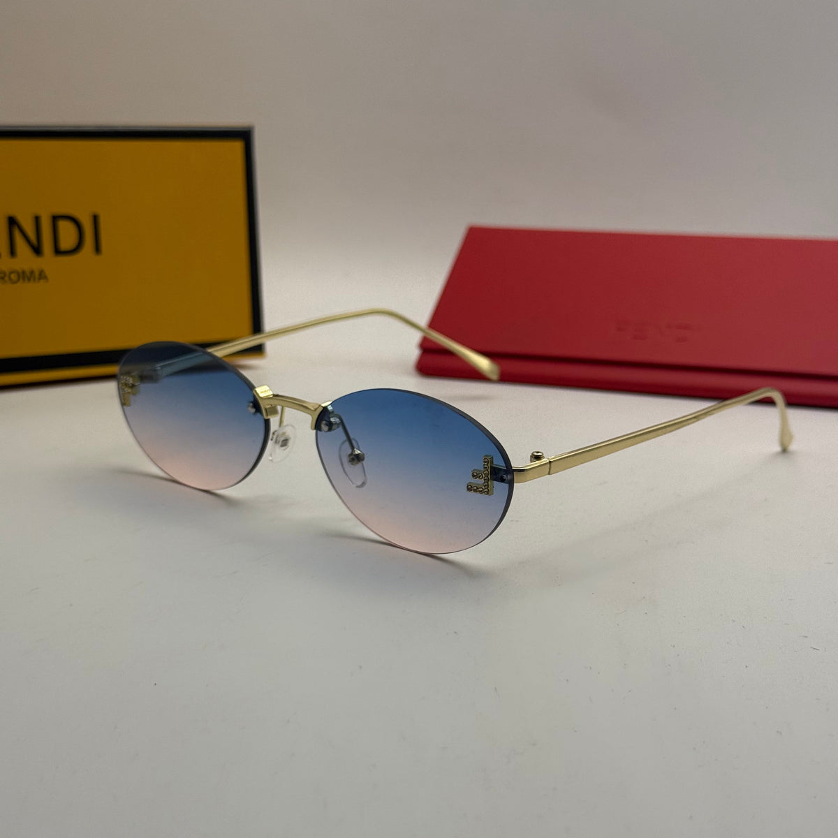 Fendi Rimless Oval Sunglasses – Blue/Pink Gradient
