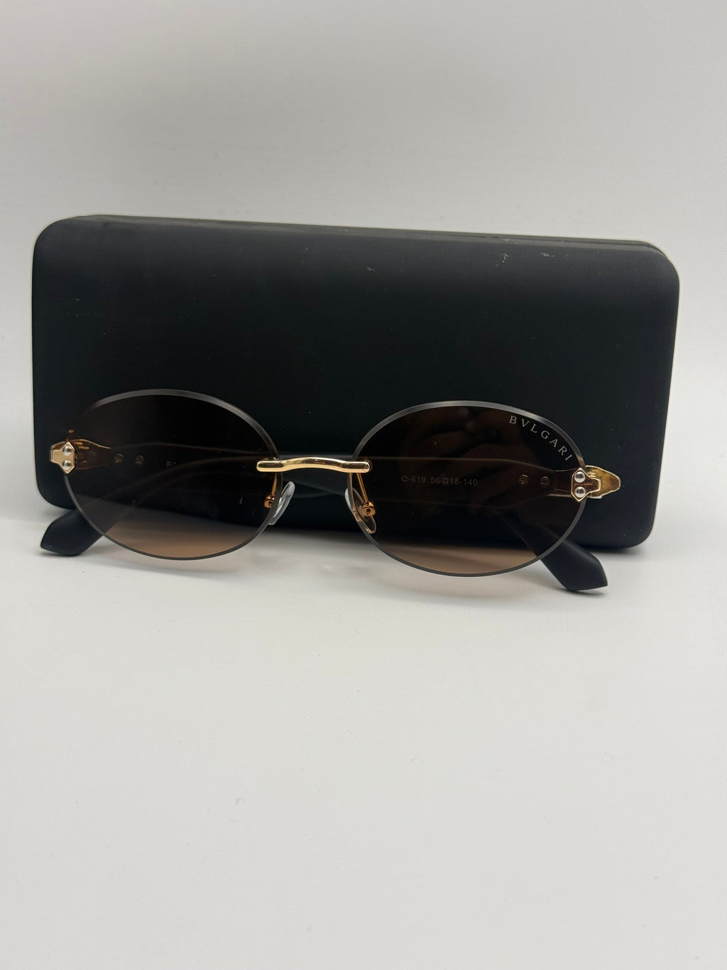 Bvlgari Rimless Oval Sunglasses – Gold & Brown