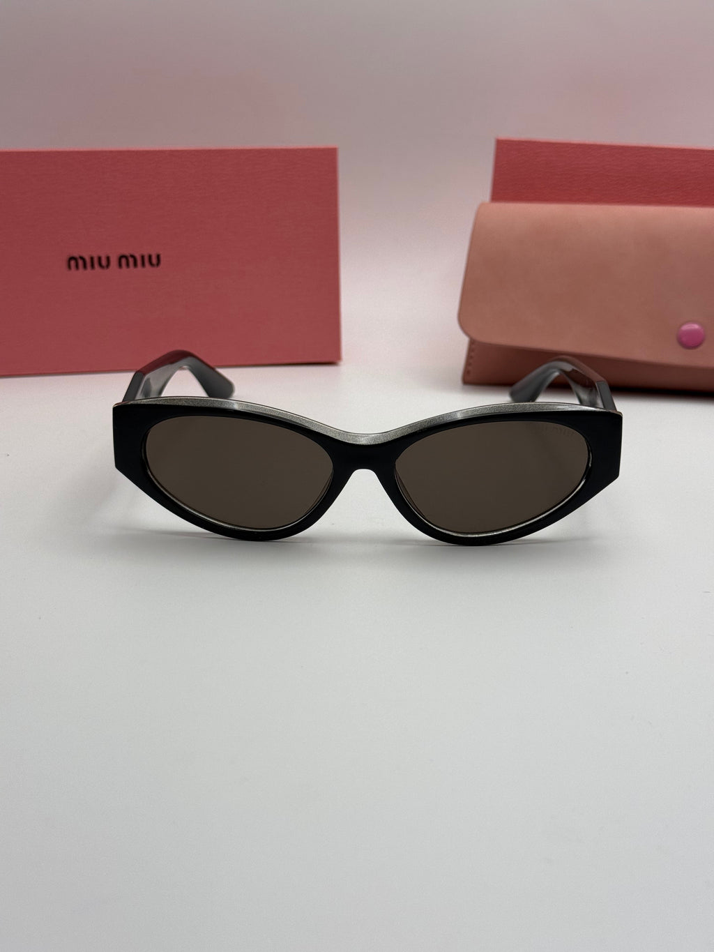 Miu Miu Oval Cat-Eye Sunglasses – Black & Silver