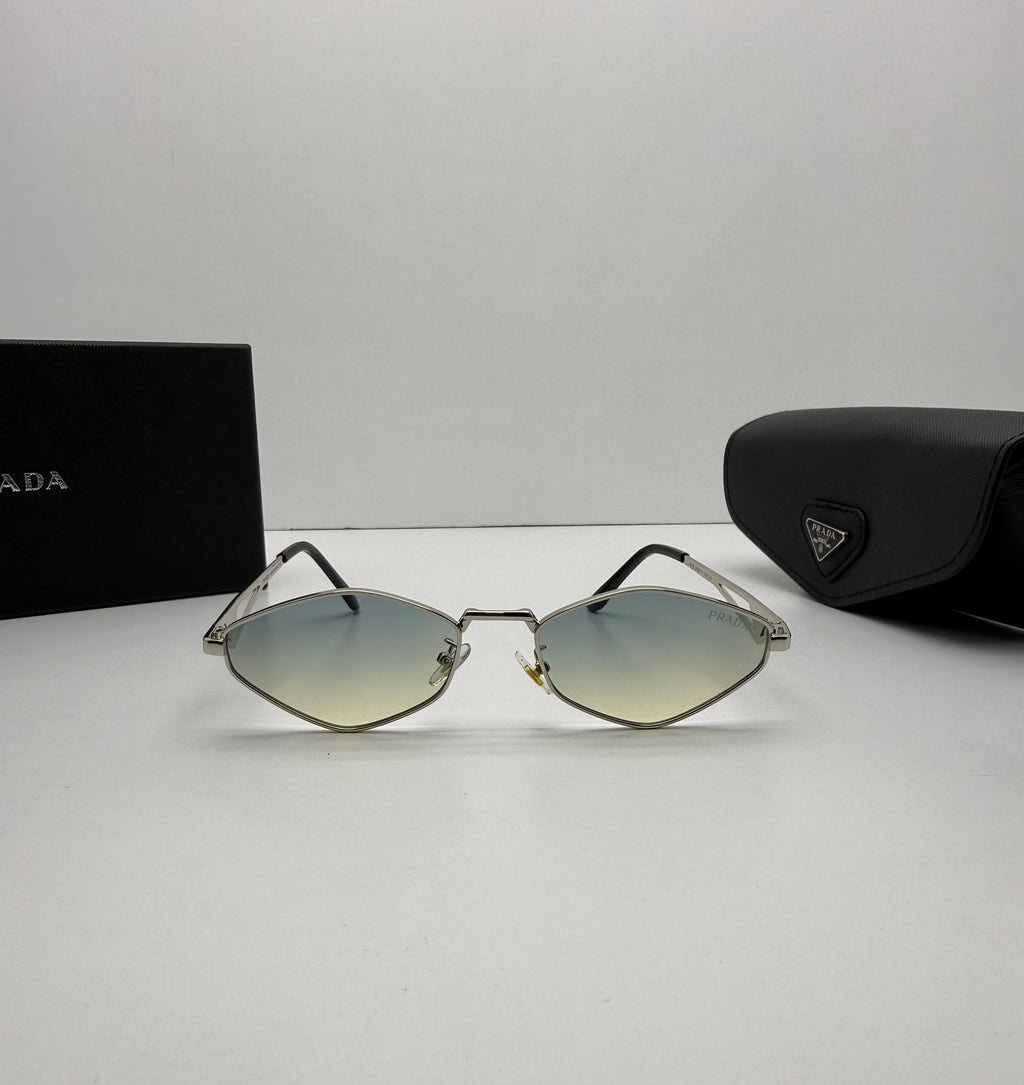 Sunglasses with Prada packaging on a light gray background