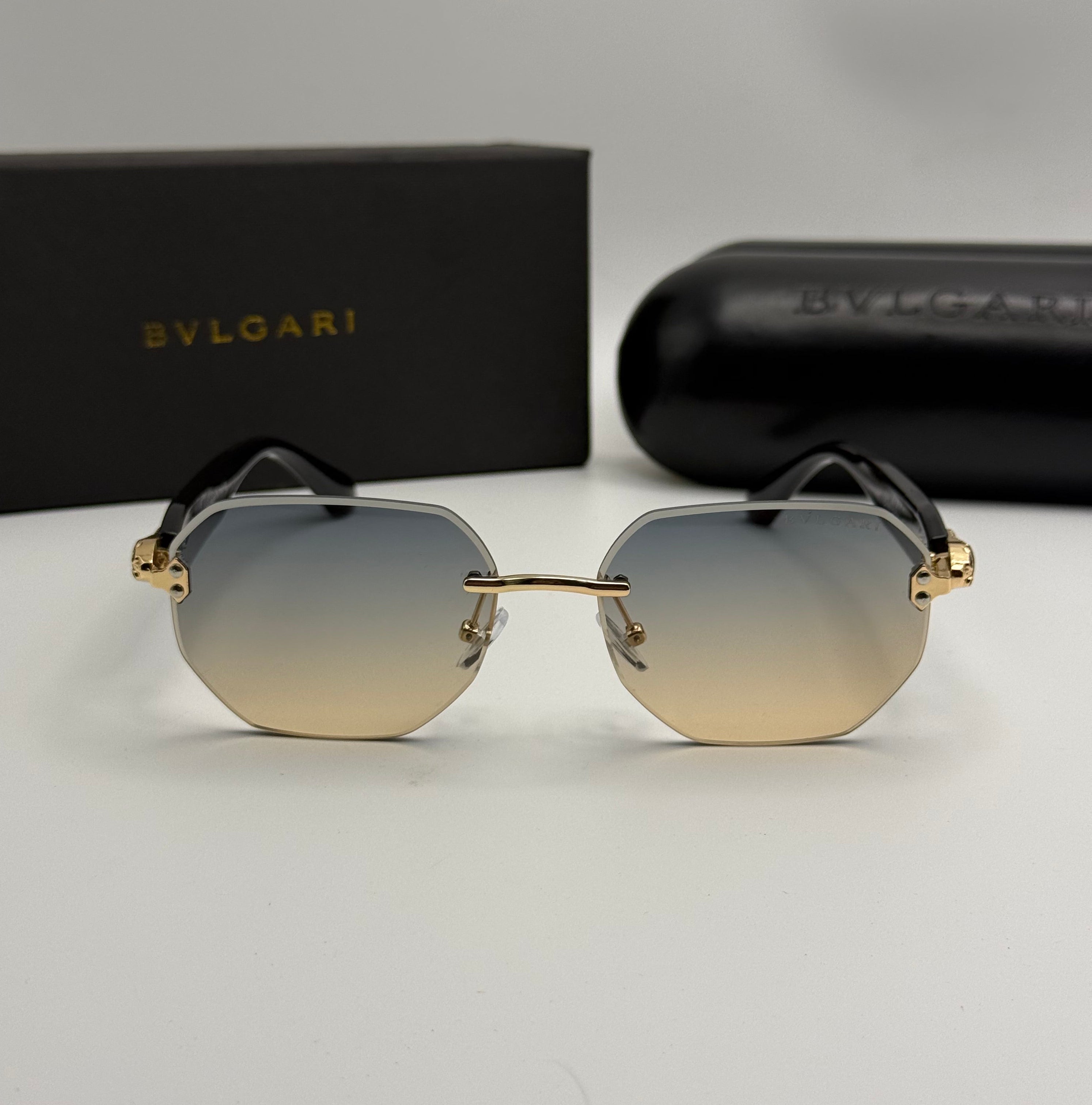 Bvlgari Rimless Geometric Sunglasses – Gold / Blue-Amber Gradient