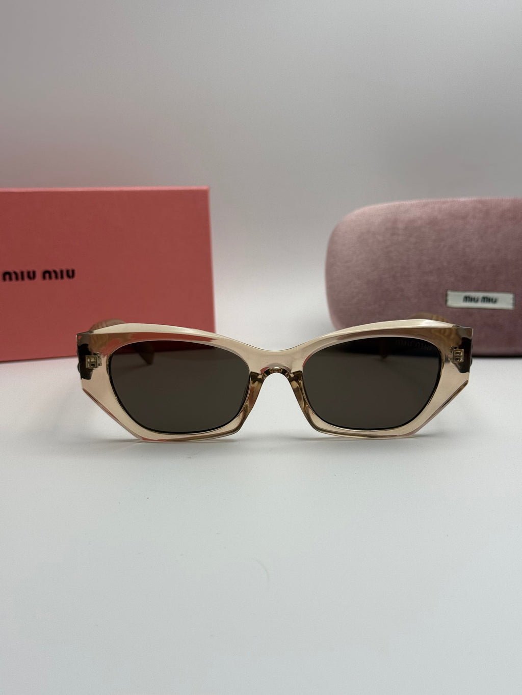 Miu Miu Cat-Eye Sunglasses – Transparent Nude / Dark Grey Lenses