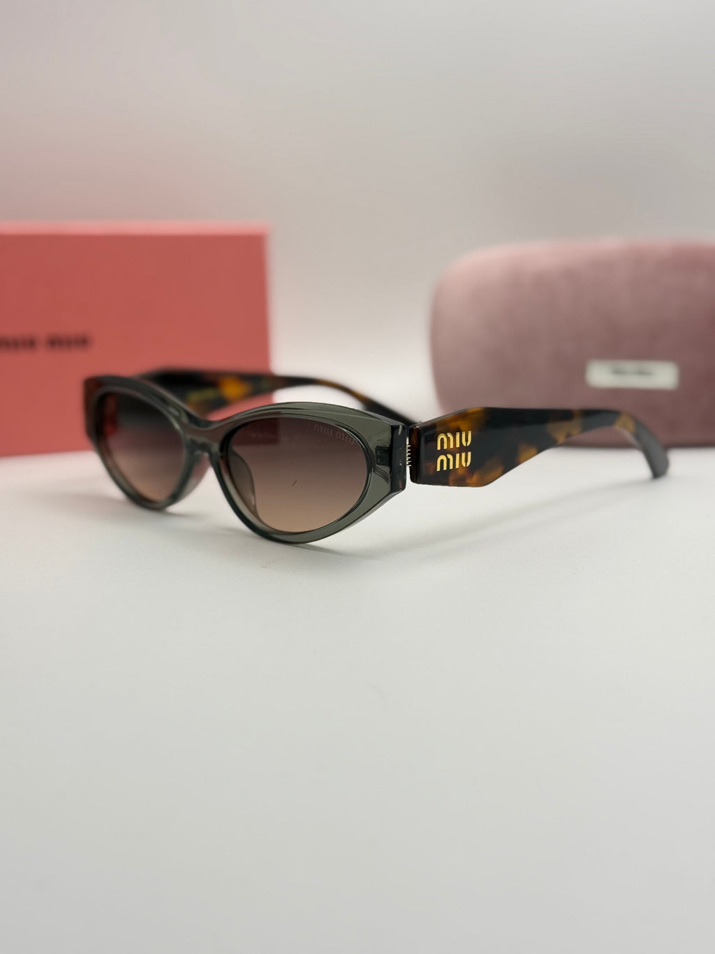 Miu Miu Oval Sunglasses – Grey Frame / Tortoise Temples / Brown Gradient Lenses
