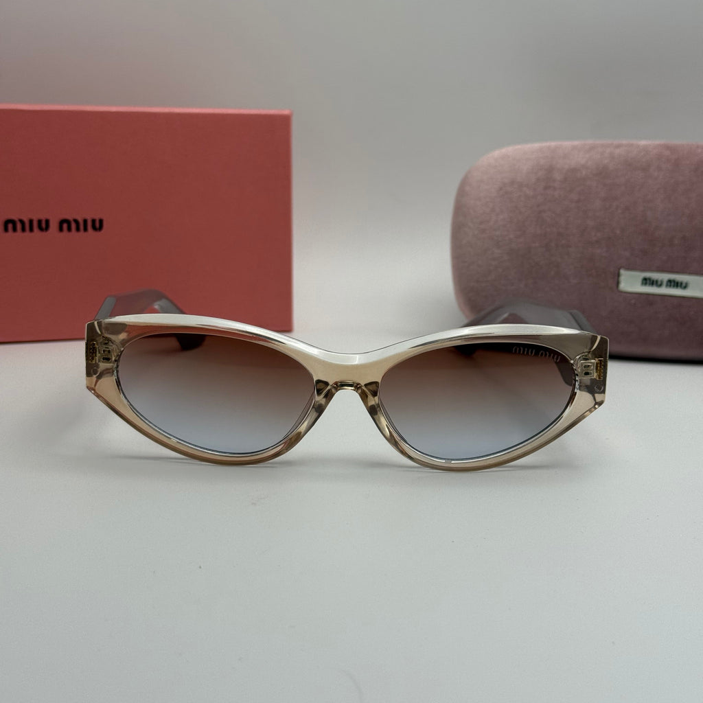 Miu Miu Oval Sunglasses – Transparent Champagne / Black Temples / Blue-Brown Gradient Lenses
